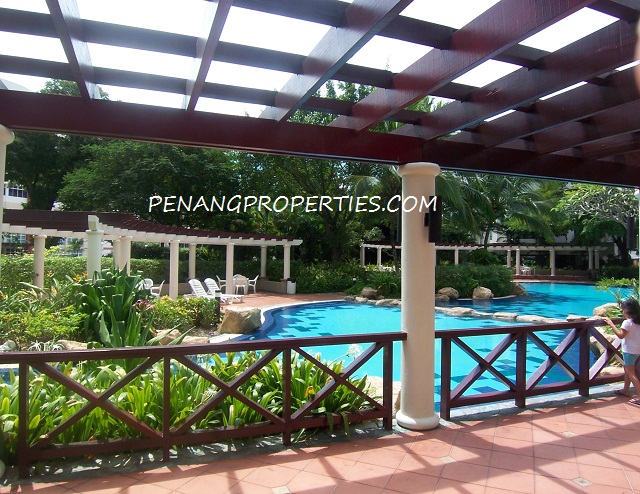 Swimming pool with shades, table and chairs